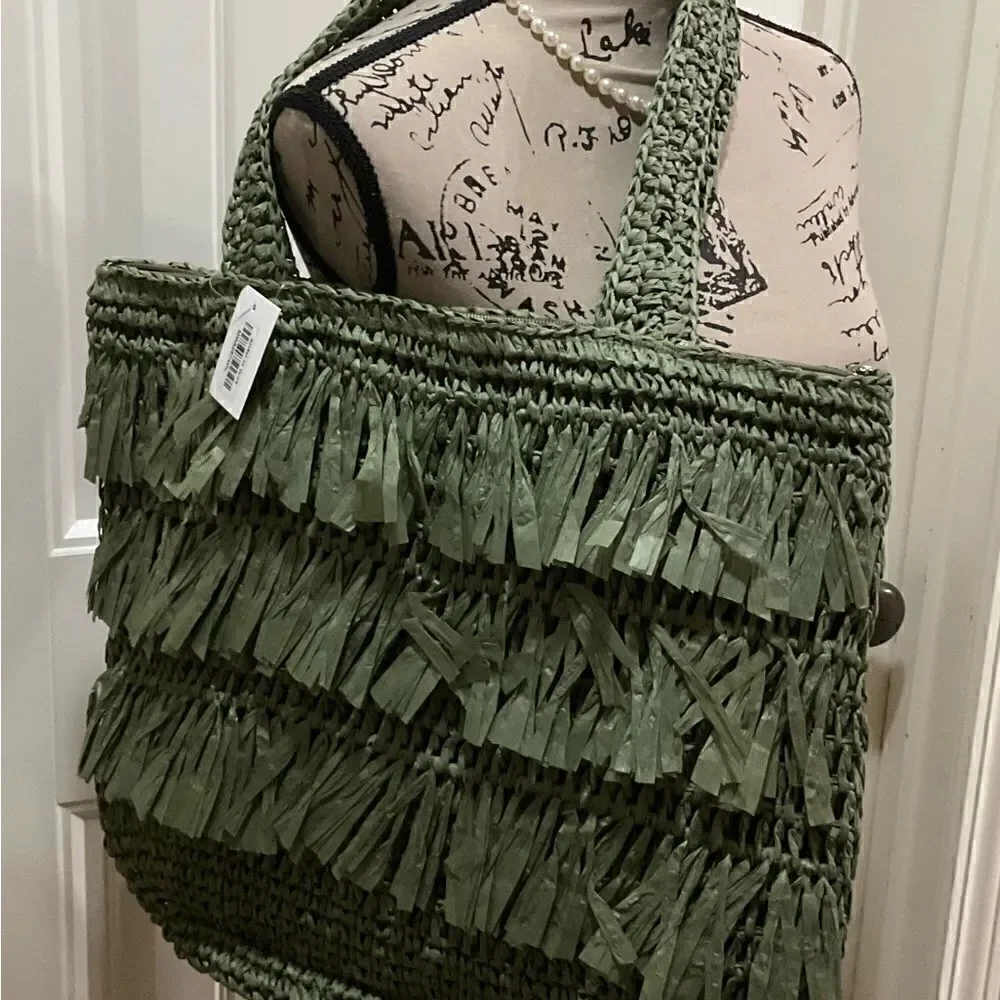 The Last Straw Fringe Straw Tote Bag. In Olive